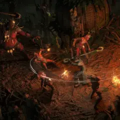 Combattimento intenso in Path of Exile 2 su PS5: un guerriero affronta un gigante rosso e creature infernali tra fiamme e rovine.