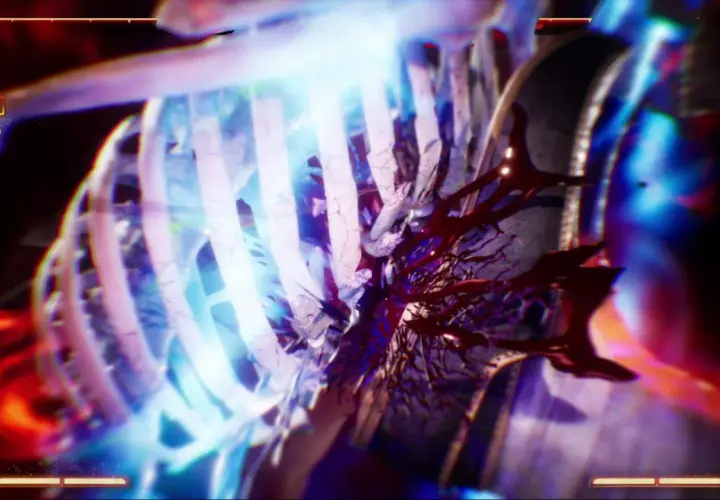 Un terrificante mortal kombat fatality: le costole si frantumano sotto un fascio di luce blu, rivelando un interno sanguinolento.