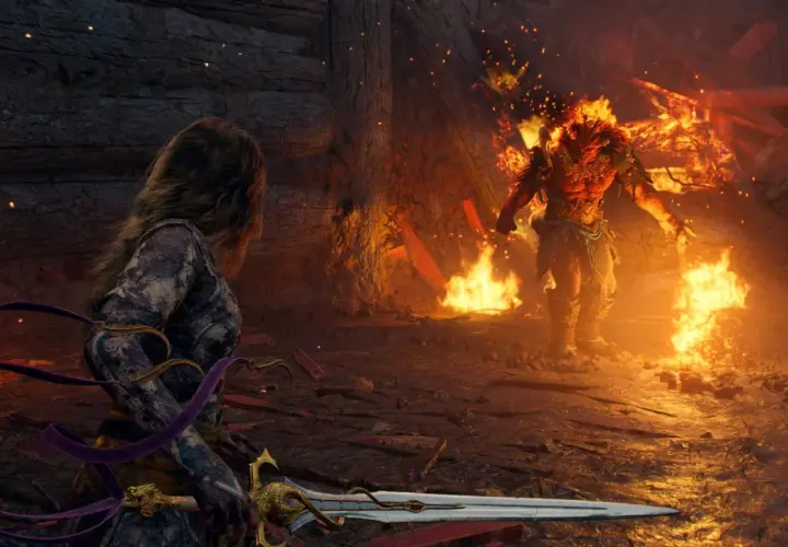 Una guerriera con spada affronta un demone infuocato, un'epica battaglia che anticipa il prossimo God of War.