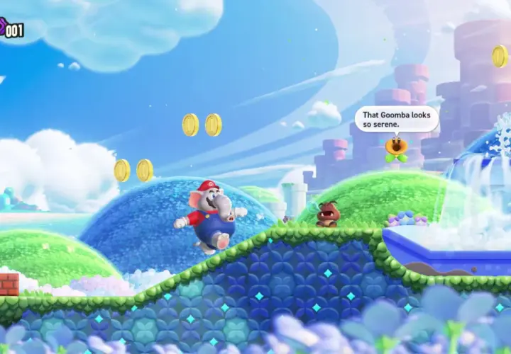 Mario, trasformato in elefante, salta in un mondo colorato di Super Mario Bros. Wonder. Un Goomba osserva una fontana serena.