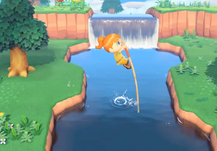 Personaggio salta un fiume con un bastone, mostrando come si gioca ad Animal Crossing.