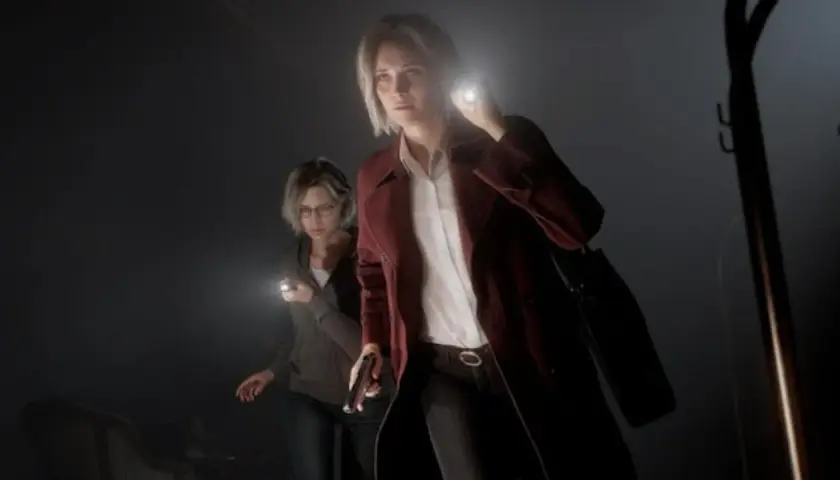 Due donne con torce esplorano un luogo buio, forse un nuovo capitolo di resident evil news.