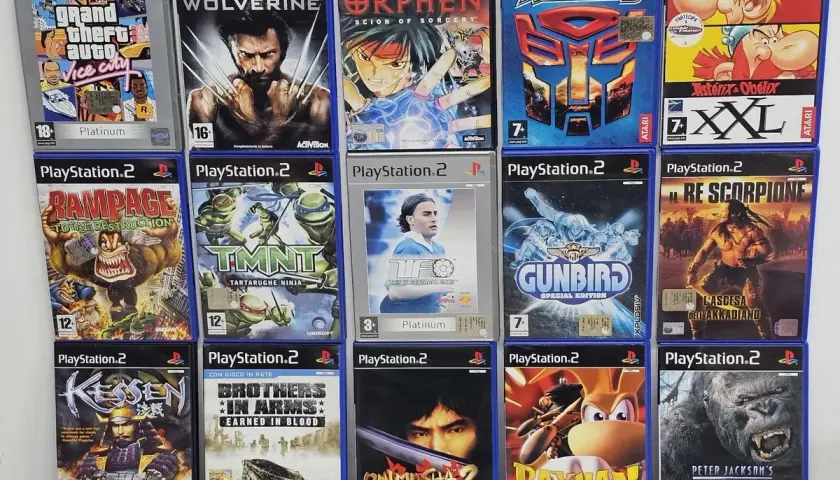 Collezione di **migliori giochi PS2**: Grand Theft Auto, Wolverine, Orphen, Transformers, TMNT, Gunbird, Kessen, Brothers in Arms, Onimusha 2, Rayman M, King Kong.