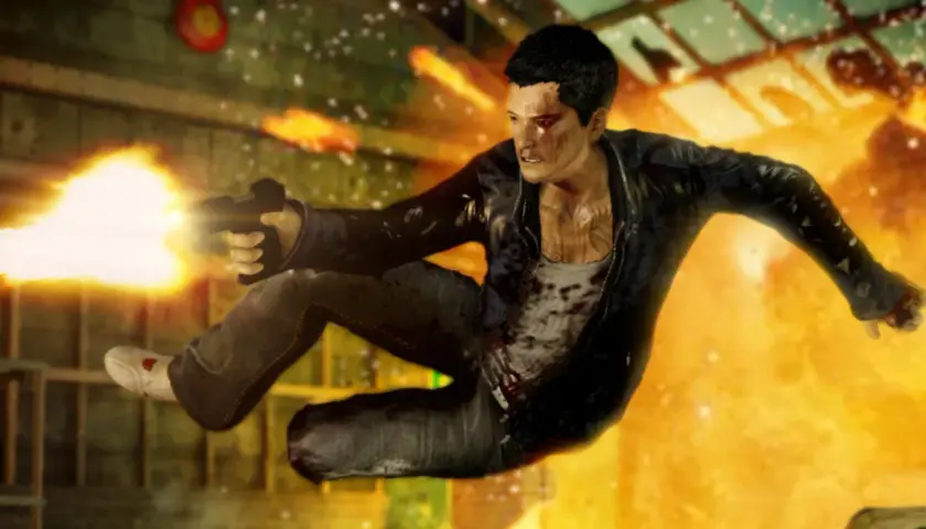 Un uomo salta in aria sparando con una pistola, circondato da fiamme e detriti. Un'intensa scena d'azione da Sleeping Dogs 2.