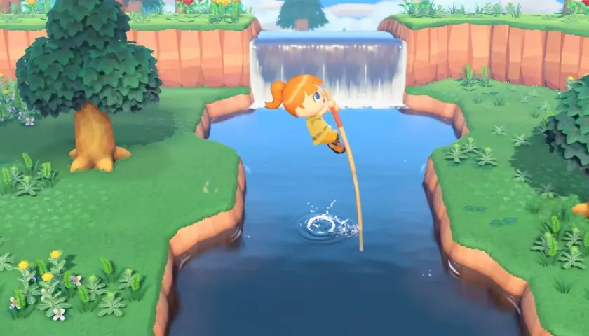 Personaggio salta un fiume con un bastone, mostrando come si gioca ad Animal Crossing.