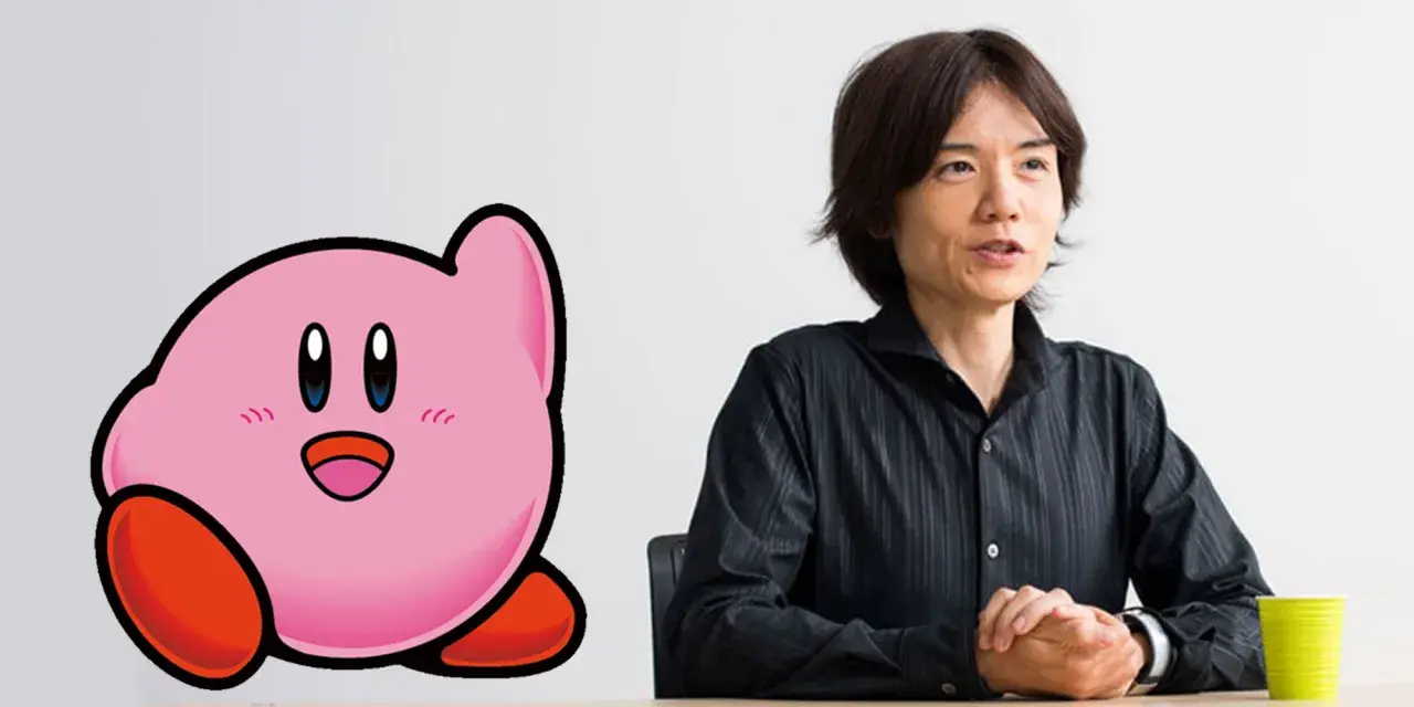 Masahiro Sakurai, chi ha creato Kirby, parla accanto al suo iconico personaggio rosa.