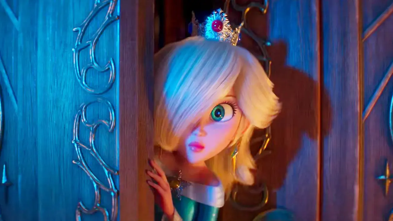 Rosalina, con la sua corona scintillante, spia da dietro una porta, pronta per nuove avventure in Super Mario Galaxy 3.