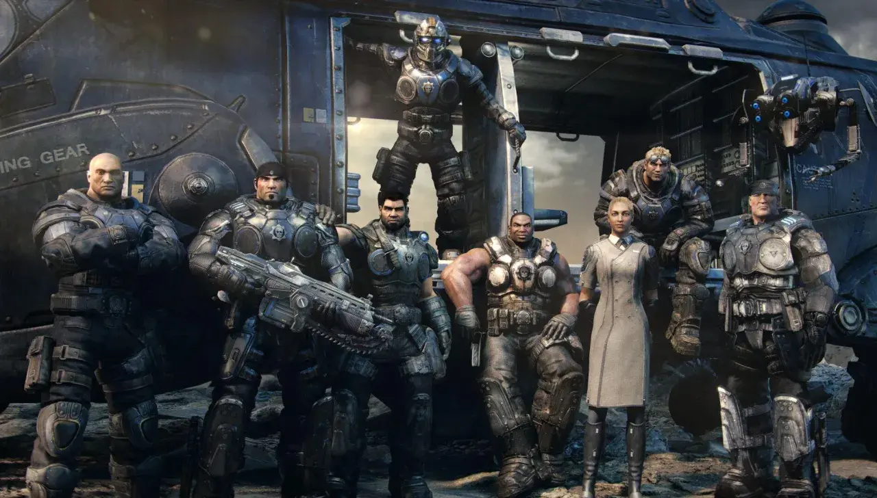 La squadra di Gears of War Reloaded, pronta all'azione davanti a un elicottero.
