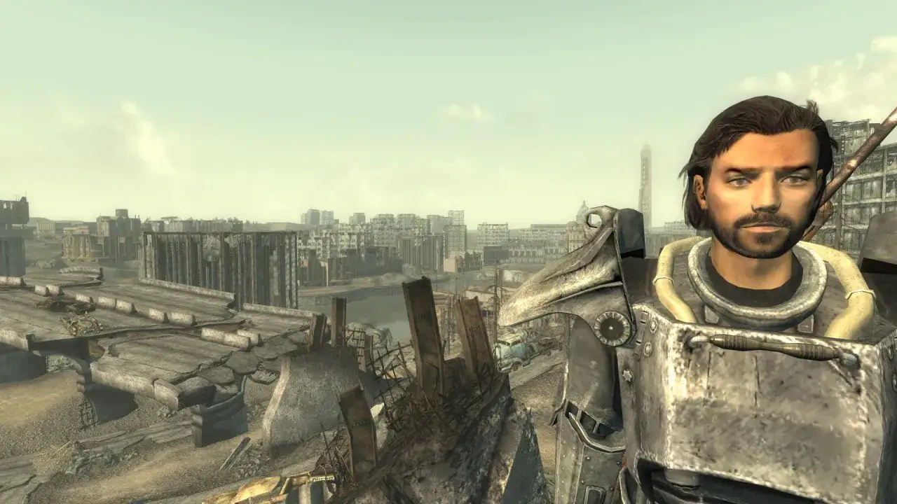 Un sopravvissuto in armatura atomica guarda la città distrutta in Fallout 3 Remastered.
