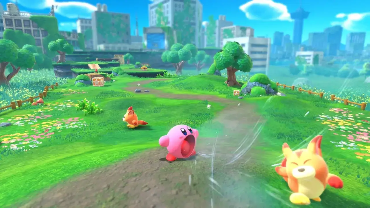 Kirby e la Terra Perduta recensione: Kirby corre in un mondo colorato, inseguito da un amico peloso, con una città in rovina sullo sfondo.