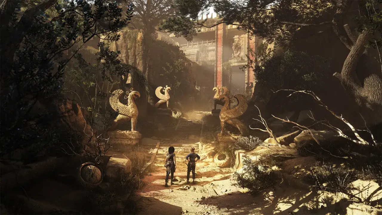 Due figure si avventurano tra rovine antiche, fiancheggiate da statue di grifoni, un'anticipazione di A Plague Tale 3.